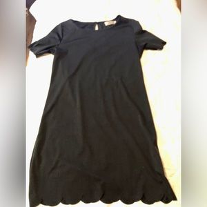 Cute black dress with scalloped hem and sleeves